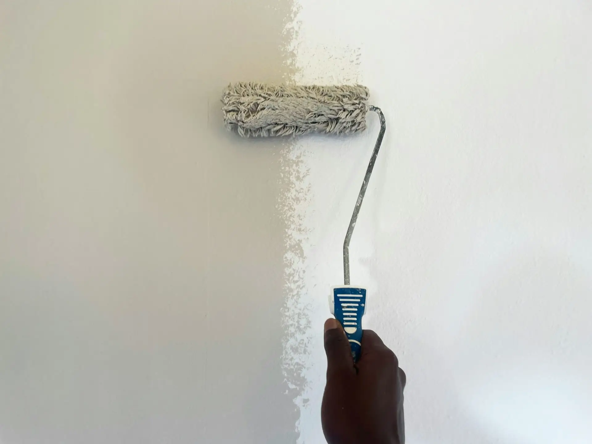 Local painting contractor painting interior wall
